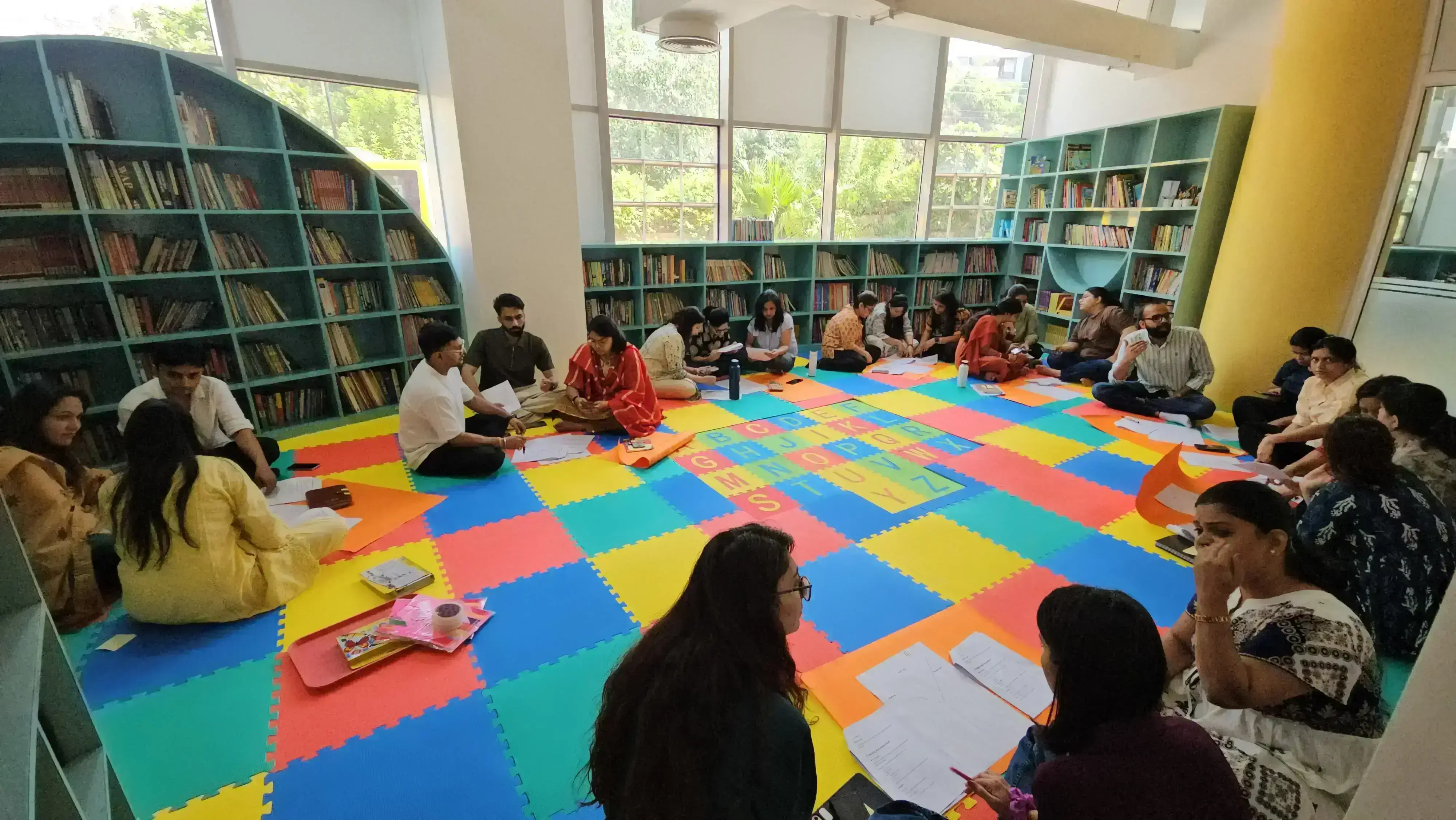 Students engaging with an educator inside an active Indian classroom setting